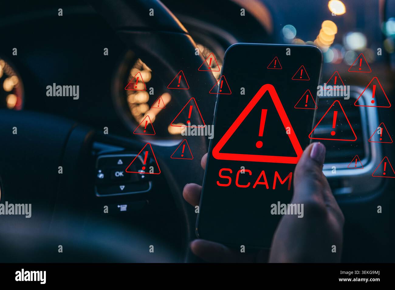 Scam message appears on a phone while someone drives at night Stock Photo