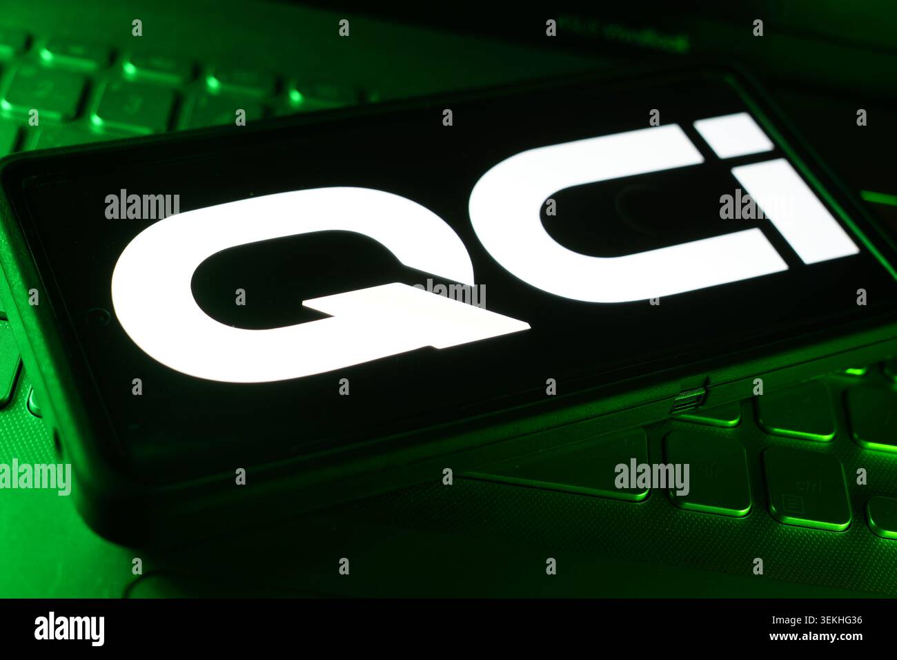 Quantum Computing Inc Company Logo On Screen Display With Computer Technology Keyboard Background And Advanced Quantum Technology Workspace Stock Photo