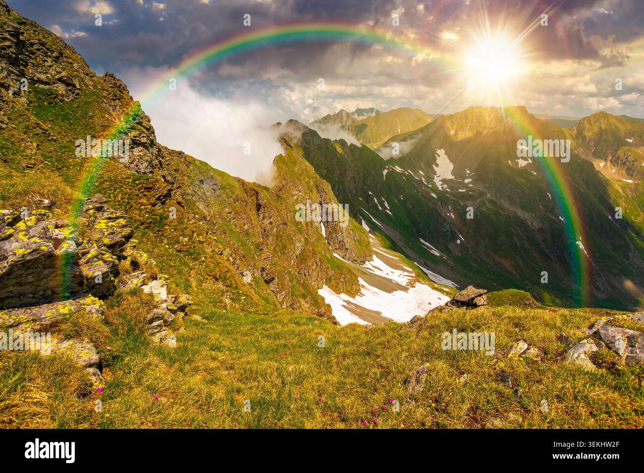 sunset over romania mountain landscape in summer. travel background of alpine scenery in fagaras mountain ridge in evening light. european summer outd Stock Photo