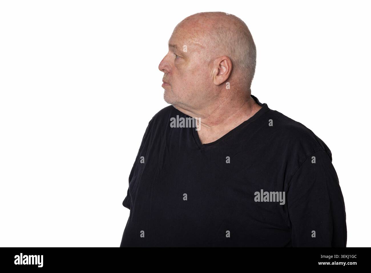 60 Year Old Man in Black T Shirt Looking Left Isolated on White Background Stock Photo