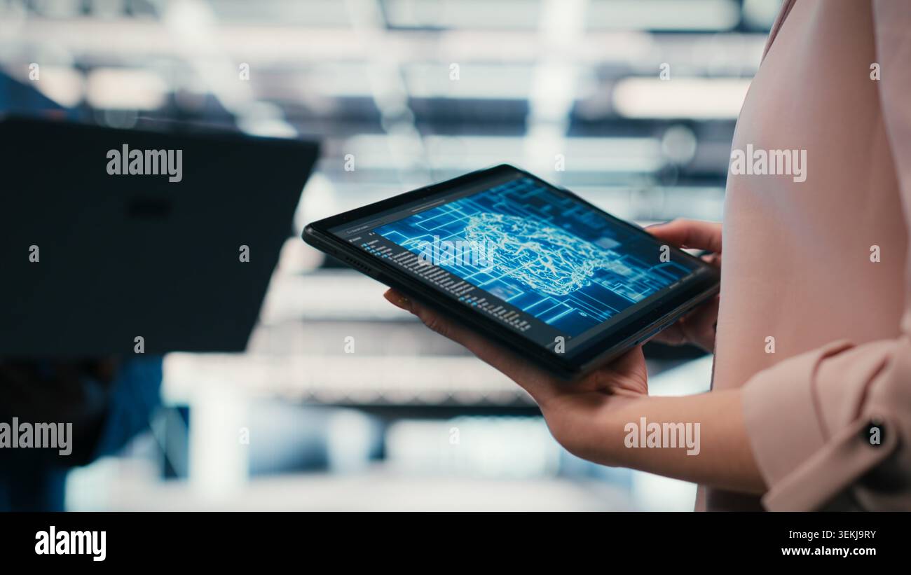 Optimizing AI performance, devices and team of technicians in data center using deep learning. Brainstorming, neural network automation and software developers in data center, camera B Stock Photo