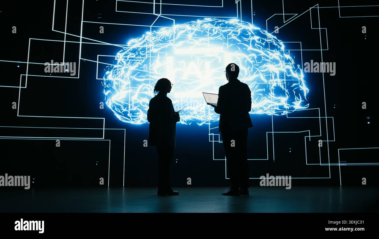 Implementing AI guardrails, devices and engineering team limiting risk of digital autonomous agent. Brainstorming, artificial intelligence safety and teamworking colleagues in tech startup, camera A Stock Photo