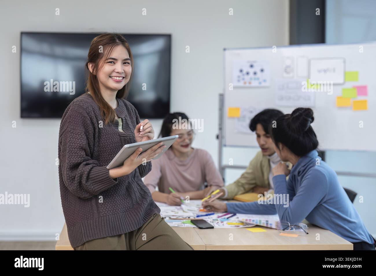 Team of ux developer and ui designer brainstorming interface wireframe design. Creative digital development agency Stock Photo