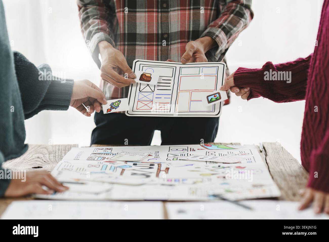 Close up ux developer and ui designer brainstorming interface wireframe design.Creative digital development agency Stock Photo