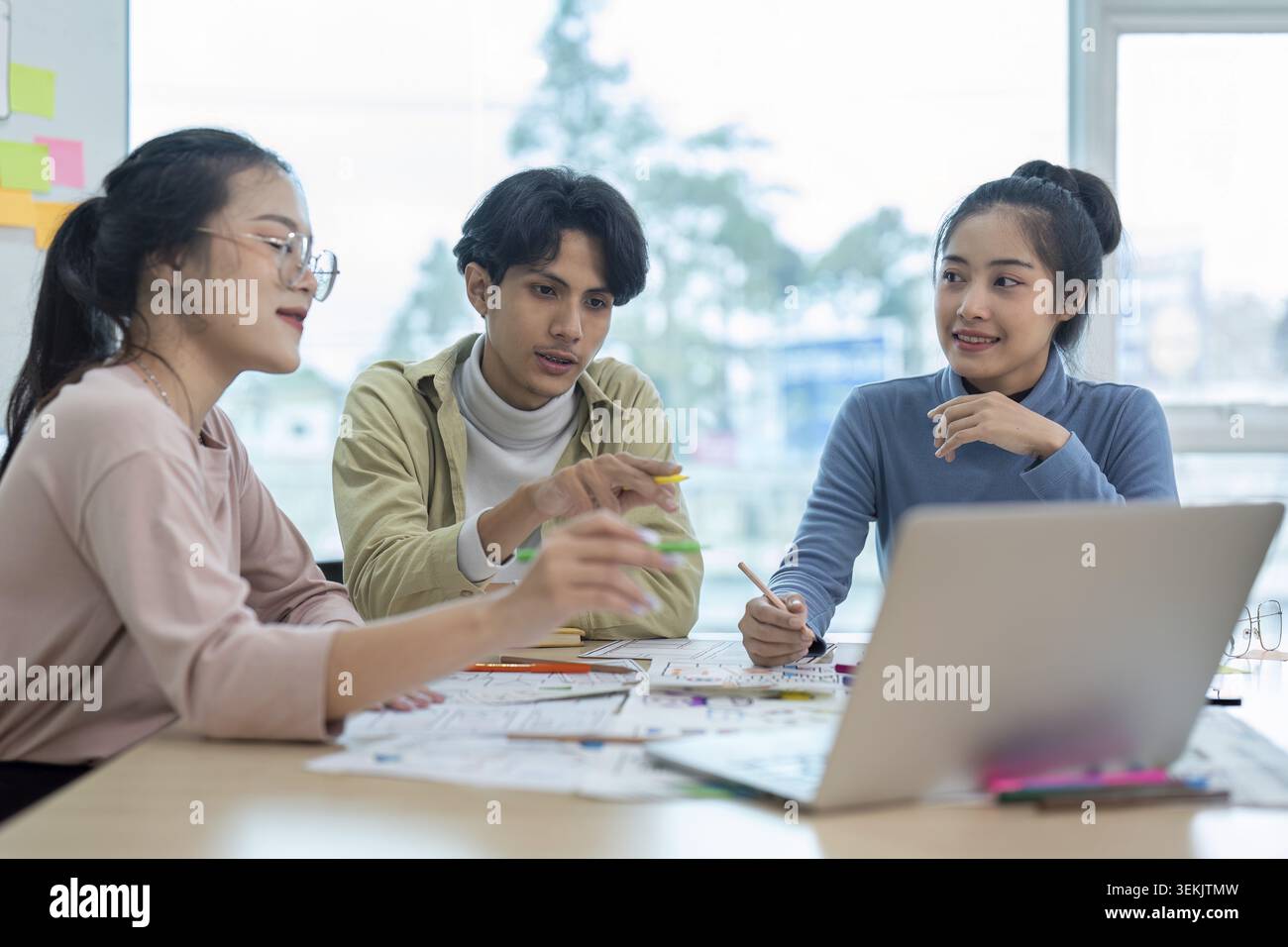 Team of ux developer and ui designer brainstorming interface wireframe design. Creative digital development agency Stock Photo