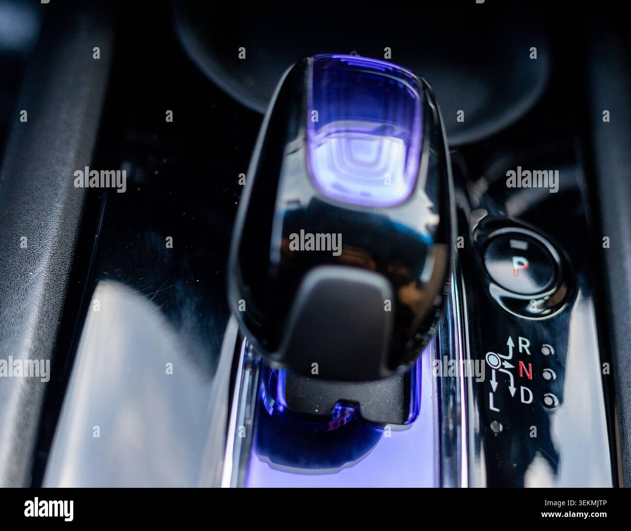 Luxury Car Gear Shifter with Ambient Lighting. Advanced Driving Controls on Vehicle Center Console. Stock Photo