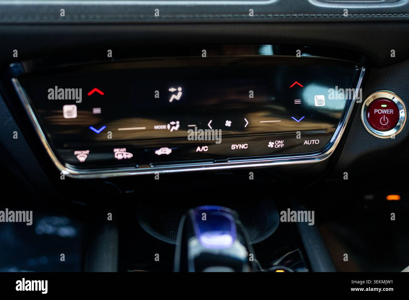 Automotive Digital Climate Control Panel Touchscreen and Red Engine Start Power Button Stock Photo