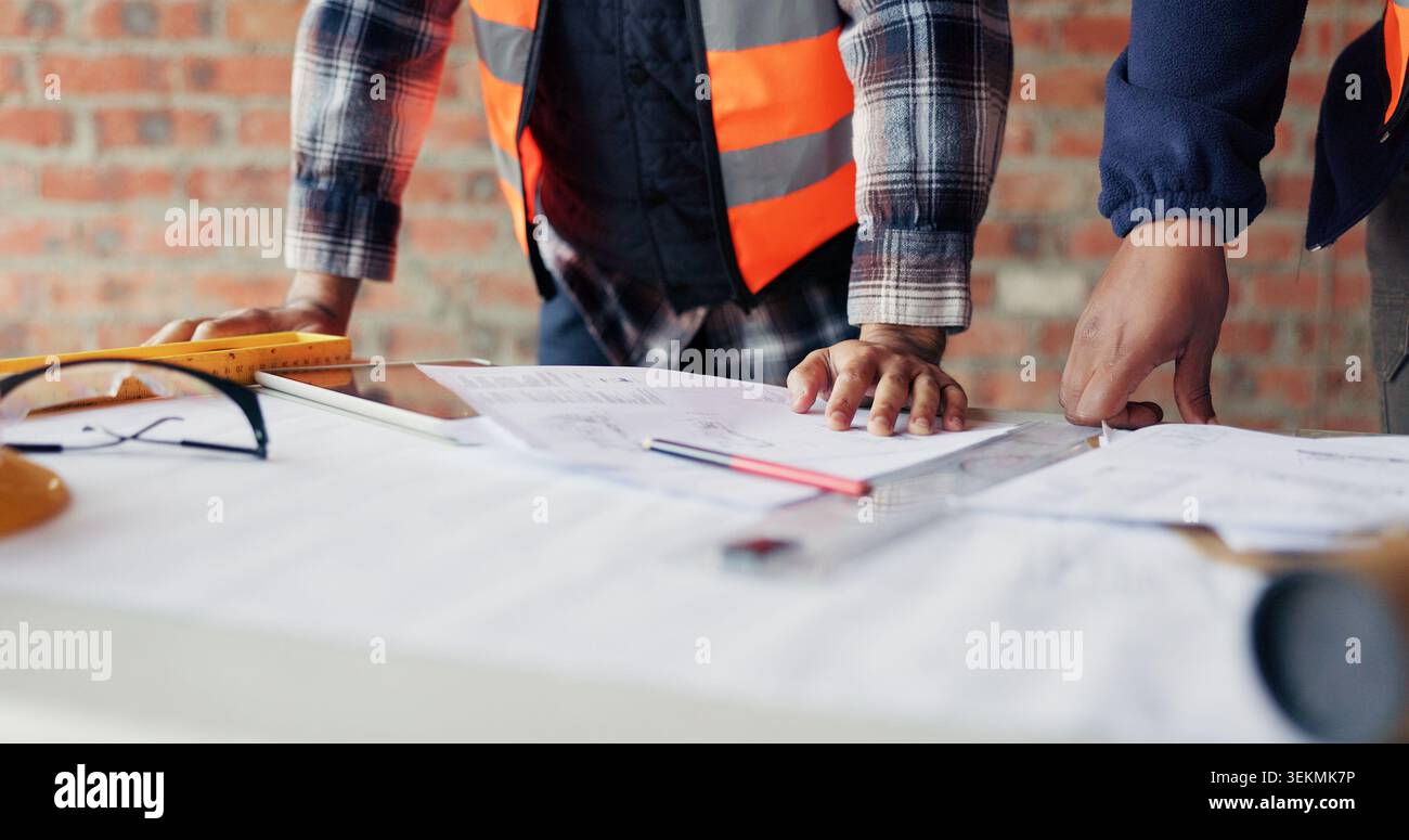 People, hands or architect with blueprint for construction planning, design or building development. Contractor, team or civil engineer with documents Stock Photo