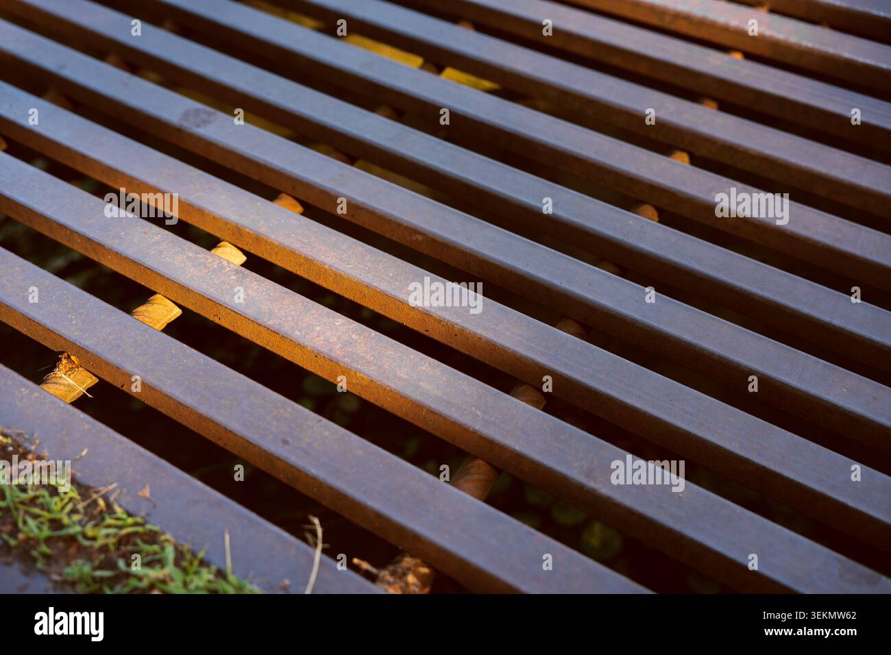 Industrial metal grate pattern with rusty iron bars and linear geometric structure background Stock Photo
