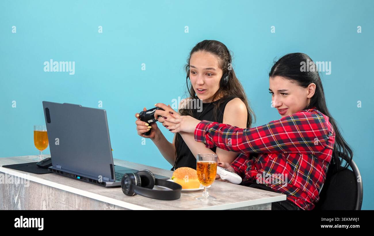 Two creative young female colleagues working together at office table desk Stock Photo