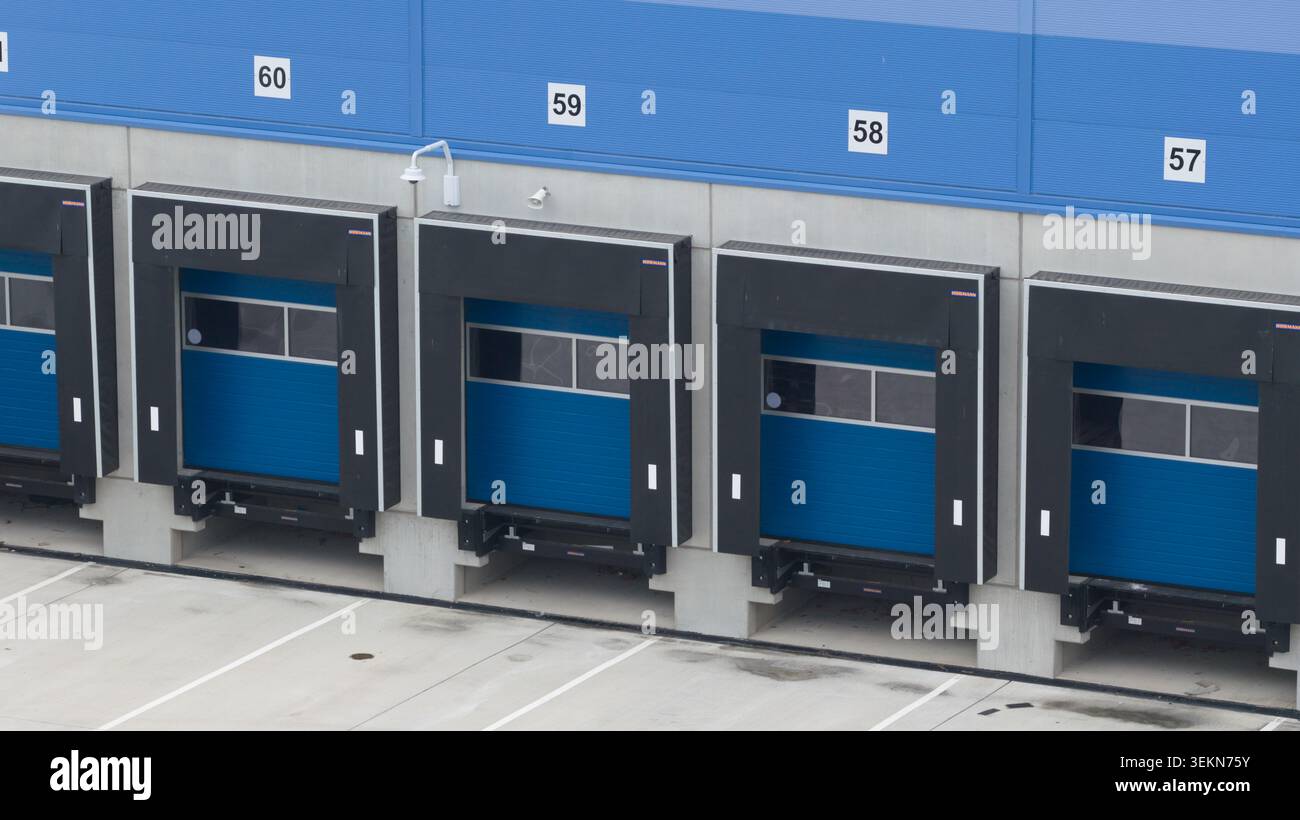 Multiple loading docks at modern distribution center facility Stock Photo
