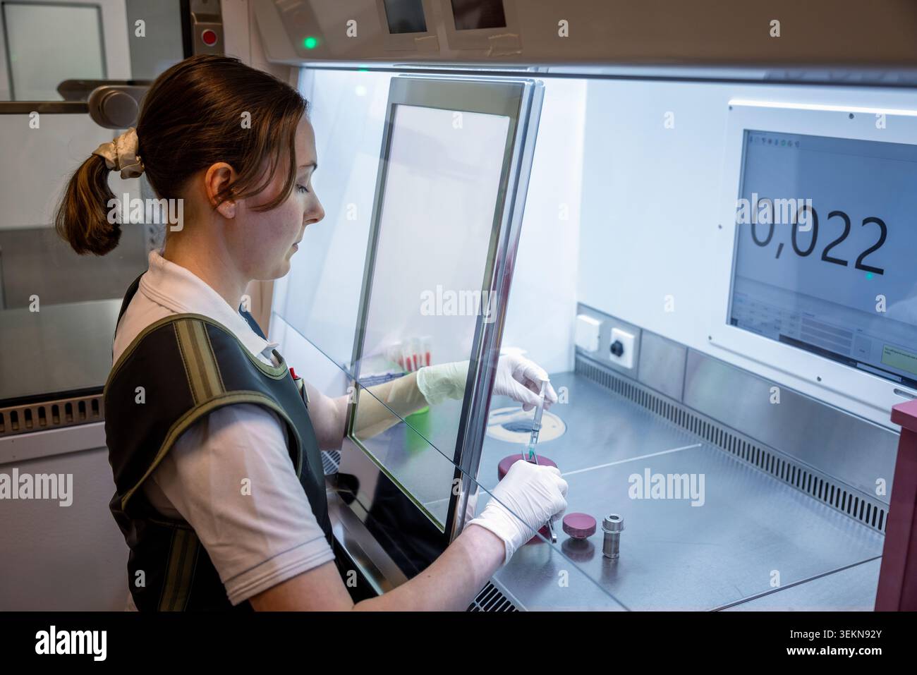 Scientist examining DNA samples while working in laboratory Stock Photo
