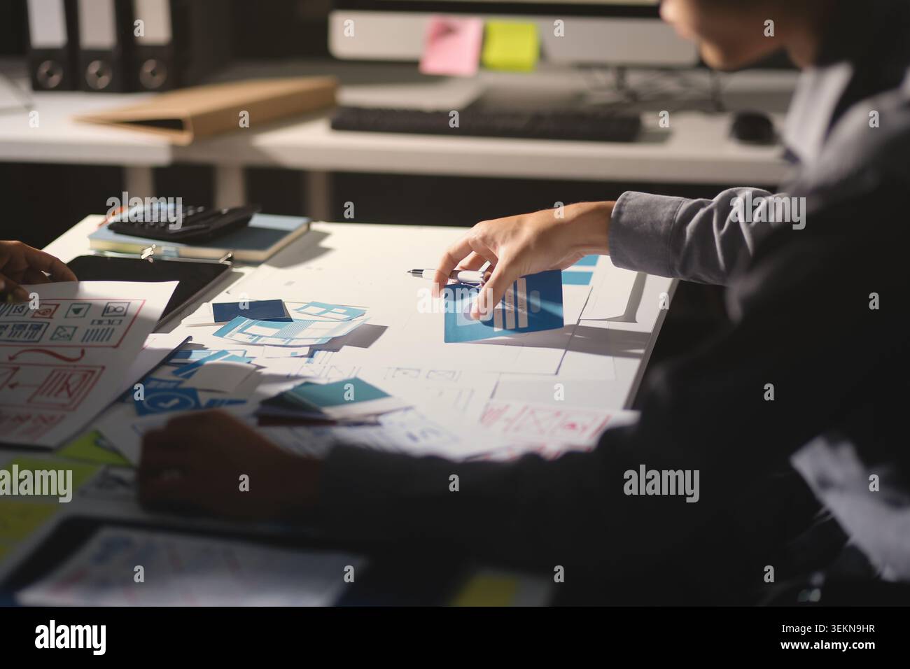 Team of Program Developer Collaborating on UXUI Design Planning in a Modern Office Environment Stock Photo