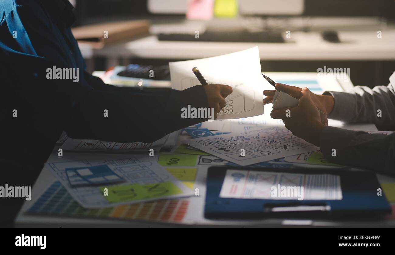 Team of Program Developer Collaborating on UXUI Design Planning in a Modern Office Environment Stock Photo