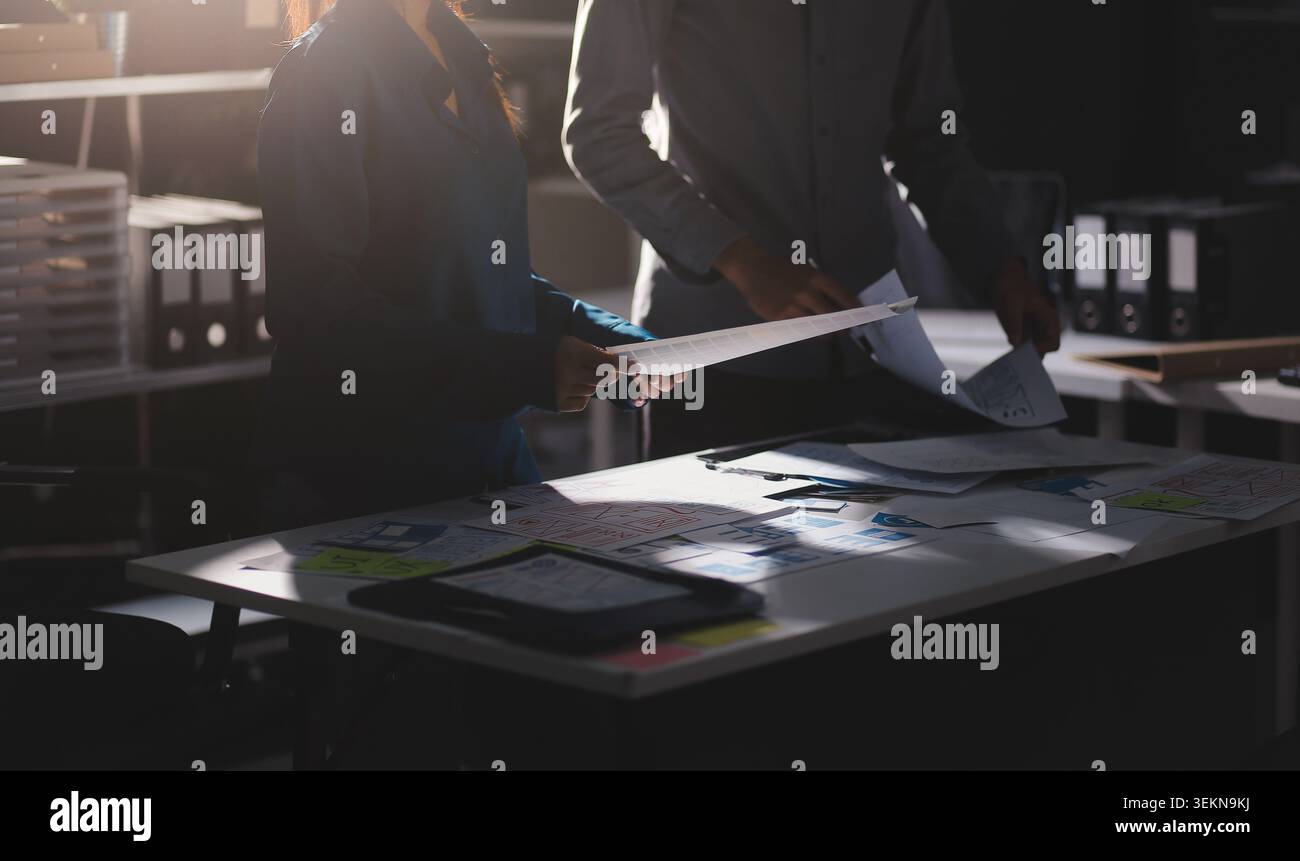 Team of Program Developer Collaborating on UXUI Design Planning in a Modern Office Environment Stock Photo