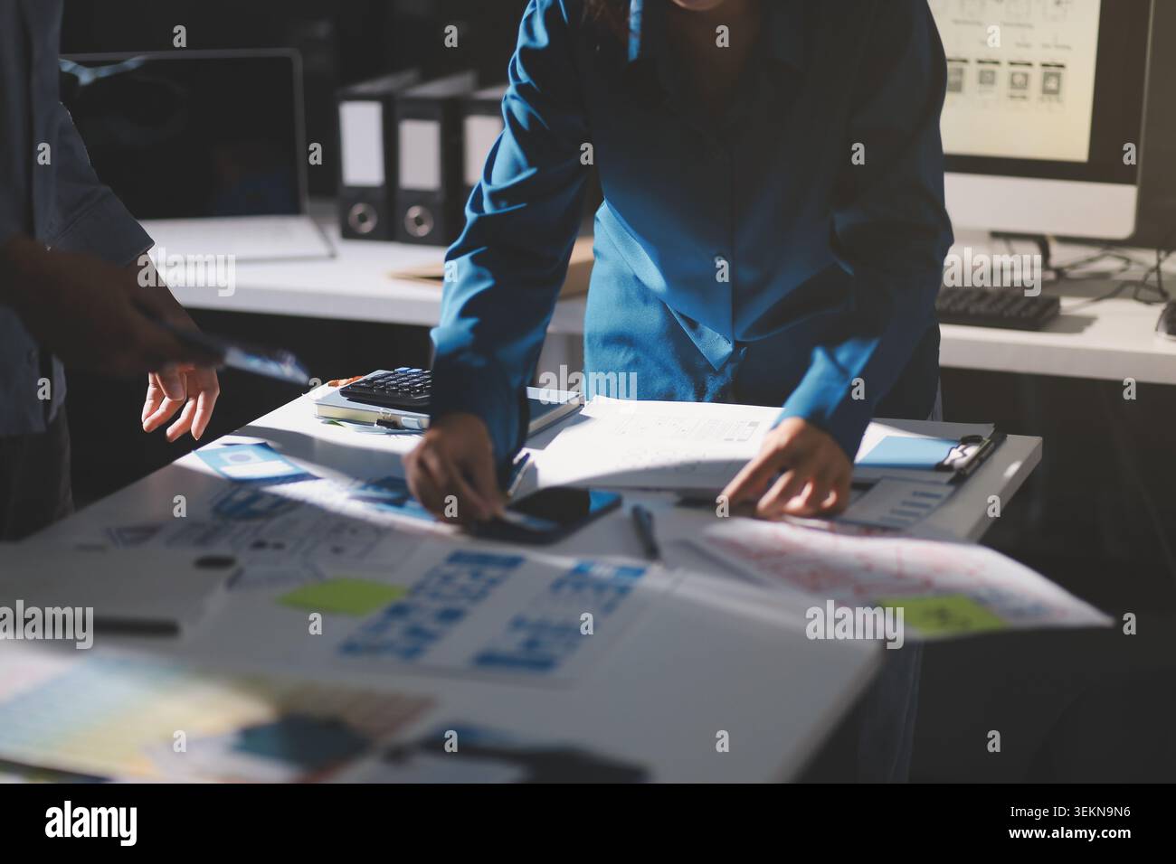 Team of Program Developer Collaborating on UXUI Design Planning in a Modern Office Environment Stock Photo
