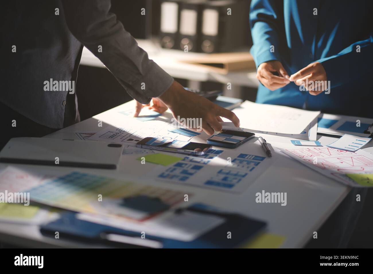 Team of Program Developer Collaborating on UXUI Design Planning in a Modern Office Environment Stock Photo