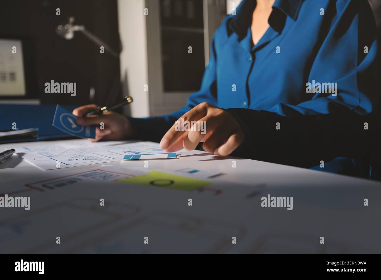 Team of Program Developer Collaborating on UXUI Design Planning in a Modern Office Environment Stock Photo
