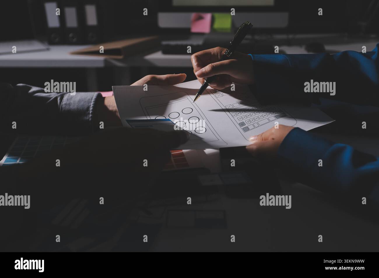 Team of Program Developer Collaborating on UXUI Design Planning in a Modern Office Environment Stock Photo