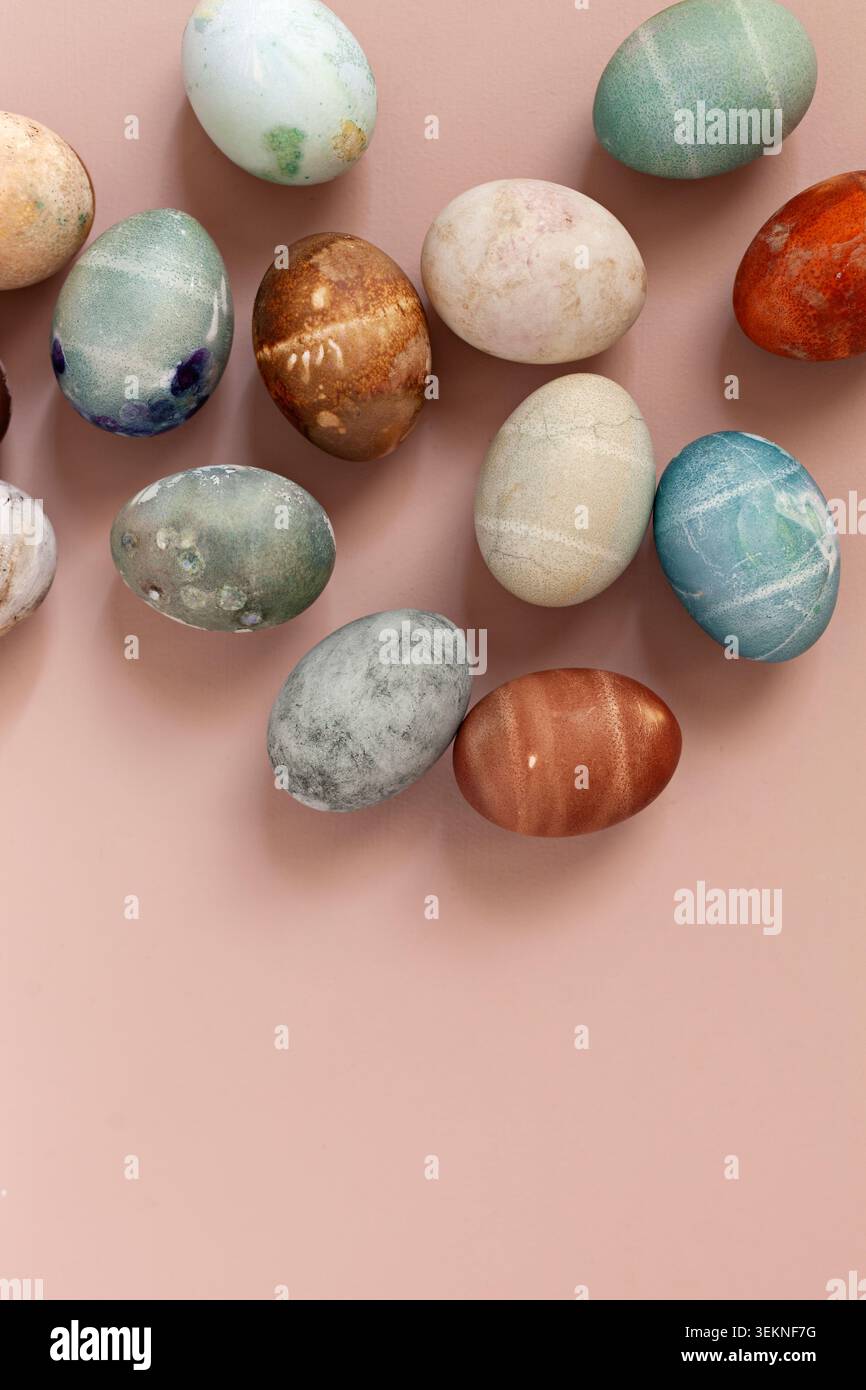 Colorful painted eggs on beige surface Stock Photo