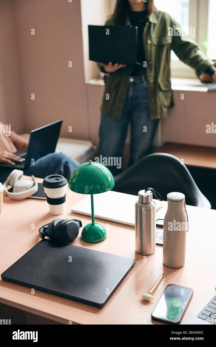 Wireless technologies with office supplies kept on table Stock Photo