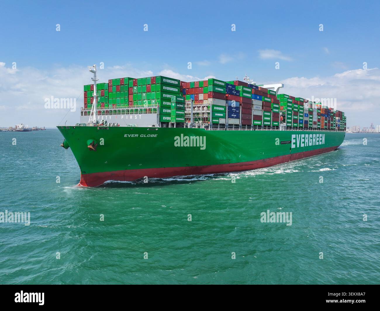 Large container ships loaded with foreign trade goods arrive at or ...