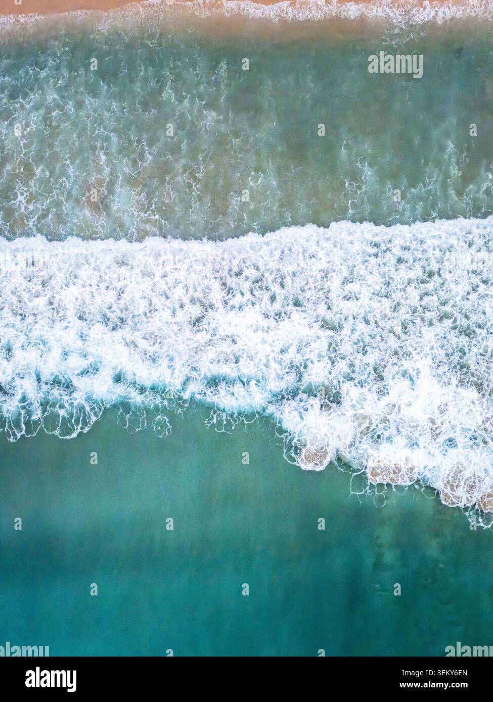 sea waves breaking and crashing surface by drone, abstract water wave shapes Stock Photo
