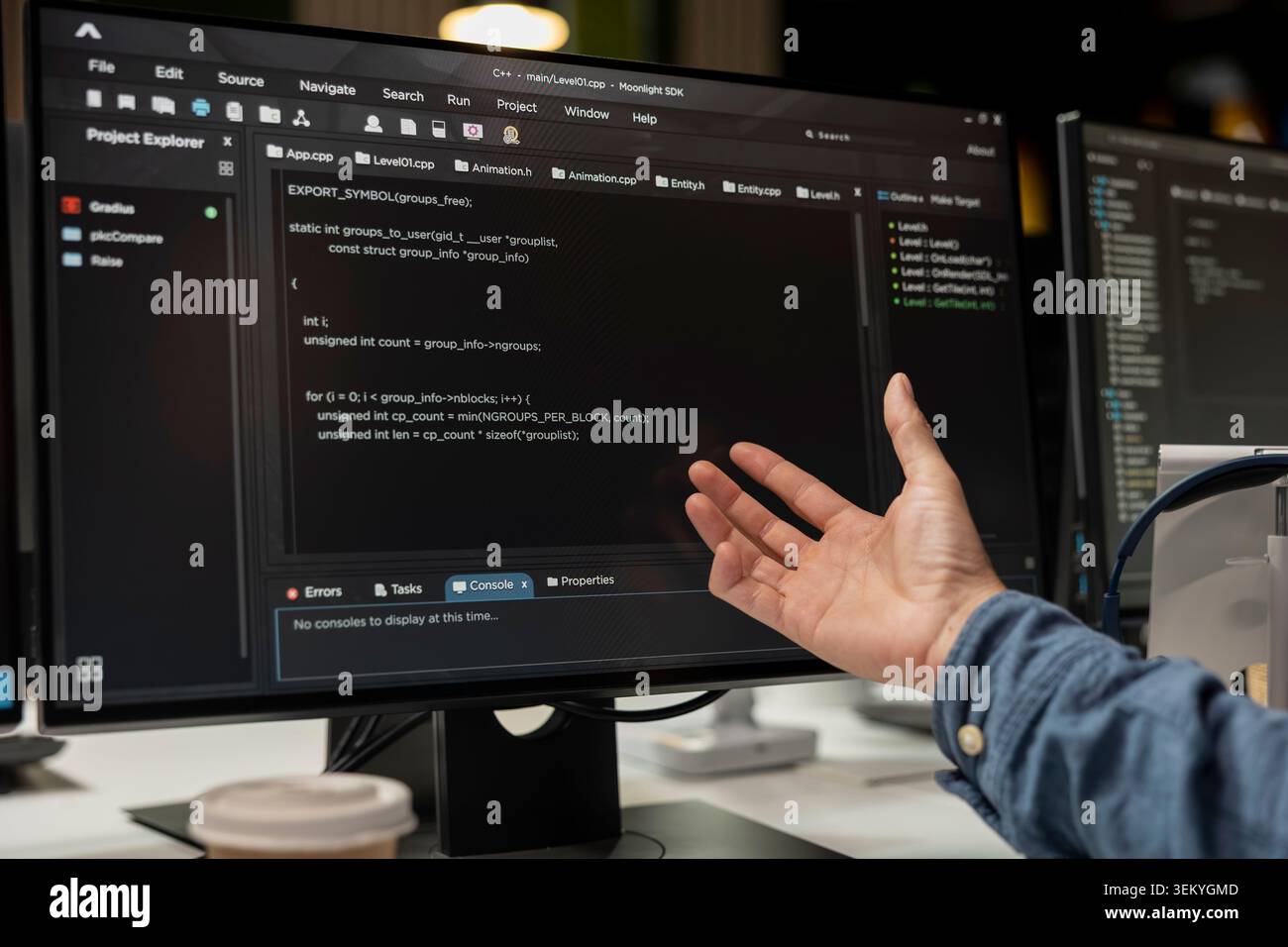 Close up of software developer coding on PC in startup office, refining machine learning models to enhance automation. IT expert using coding platform on computer in tech company workplace Stock Photo