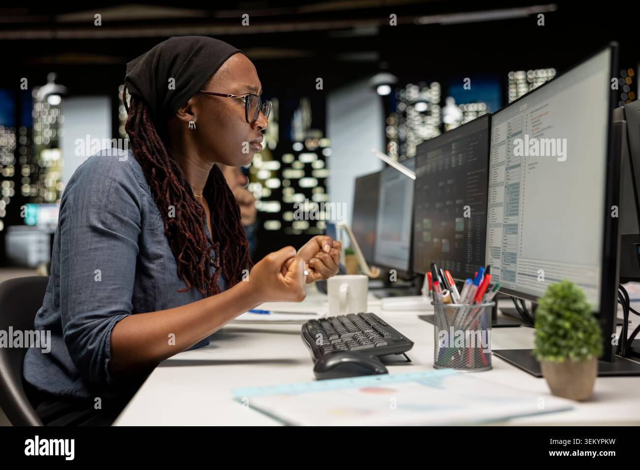 Developer utilizing AI LLM assistant on computer to optimize performance and forecast issues. IT expert in tech company office training neural network deep learning models to perform automatic updates Stock Photo