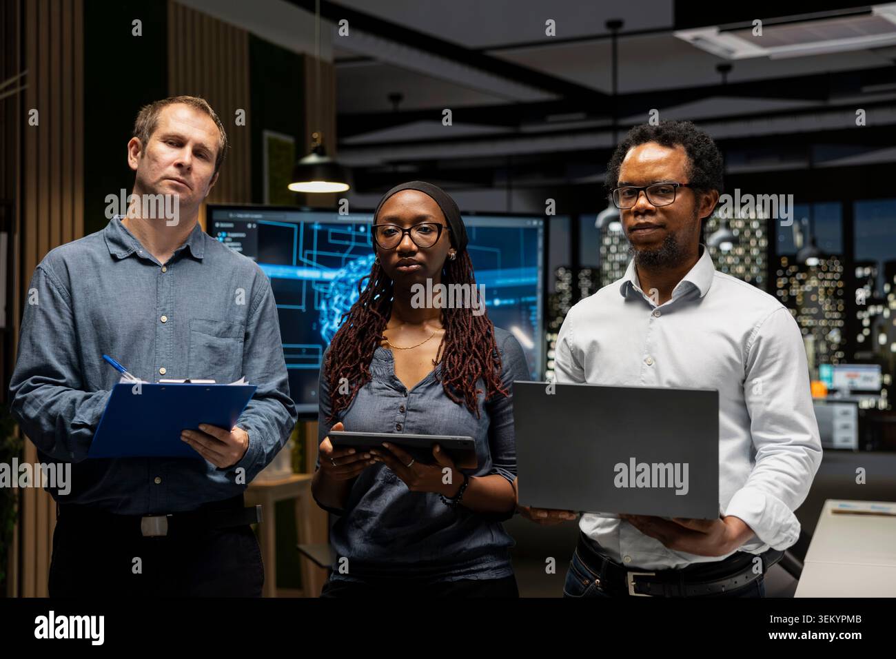 Portrait of engineers in office automating repetitive tasks using AI scripts on devices. Teamworking IT experts using artificial intelligence to speed up feature implementation Stock Photo