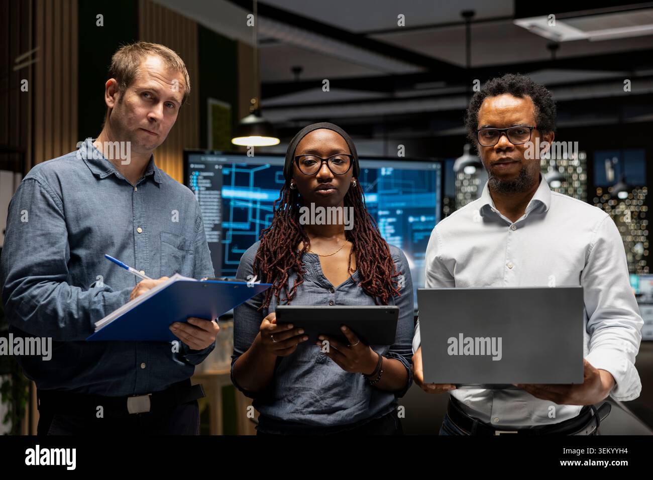 Portrait of teamworking engineers writing code, developing machine learning APIs. Team of IT professionals troubleshooting software errors using artificial intelligence, resolving system crashes Stock Photo
