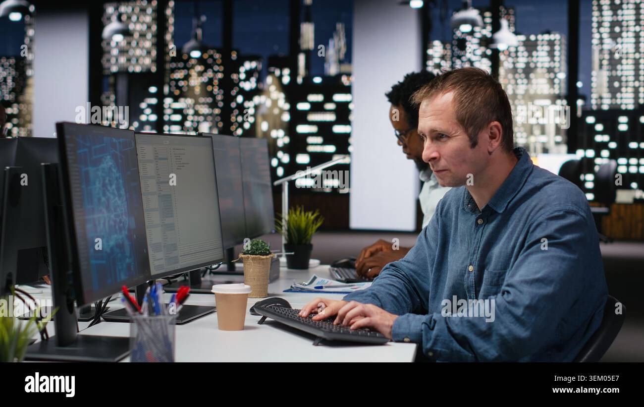 Engineer in company workplace drinking coffee, doing artificial intelligence tech quality assurance. Worker in office enjoying caffeinated beverage, writing AI script with programming languages Stock Photo