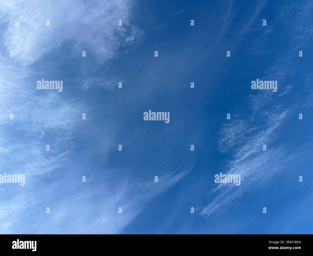Light cirrus clouds in the blue sky Stock Photo