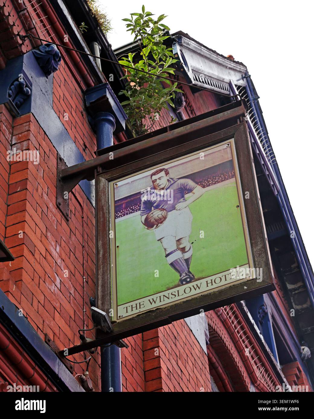 The Winslow Hotel pub sign near Goodison Park in Everton, Liverpool, England, UK, showing a historic football image. Stock Photo