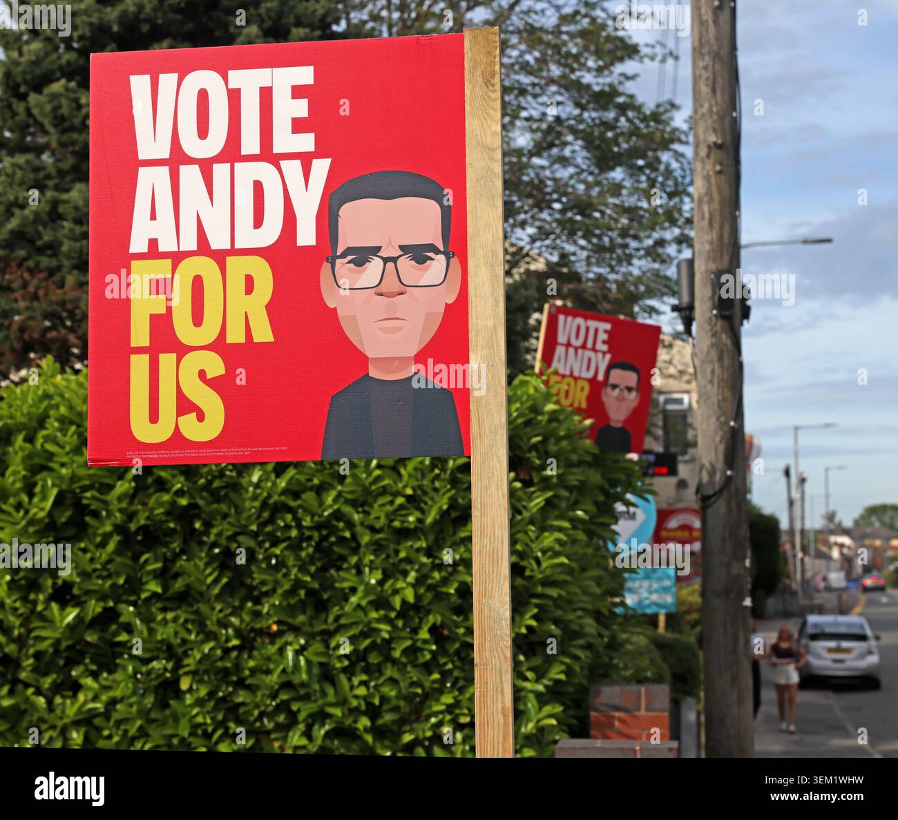 Andy Burnham campaign posters on a residential street in Makerfield, using the Vote Andy For Us slogan, with ReformUK ones behind Stock Photo
