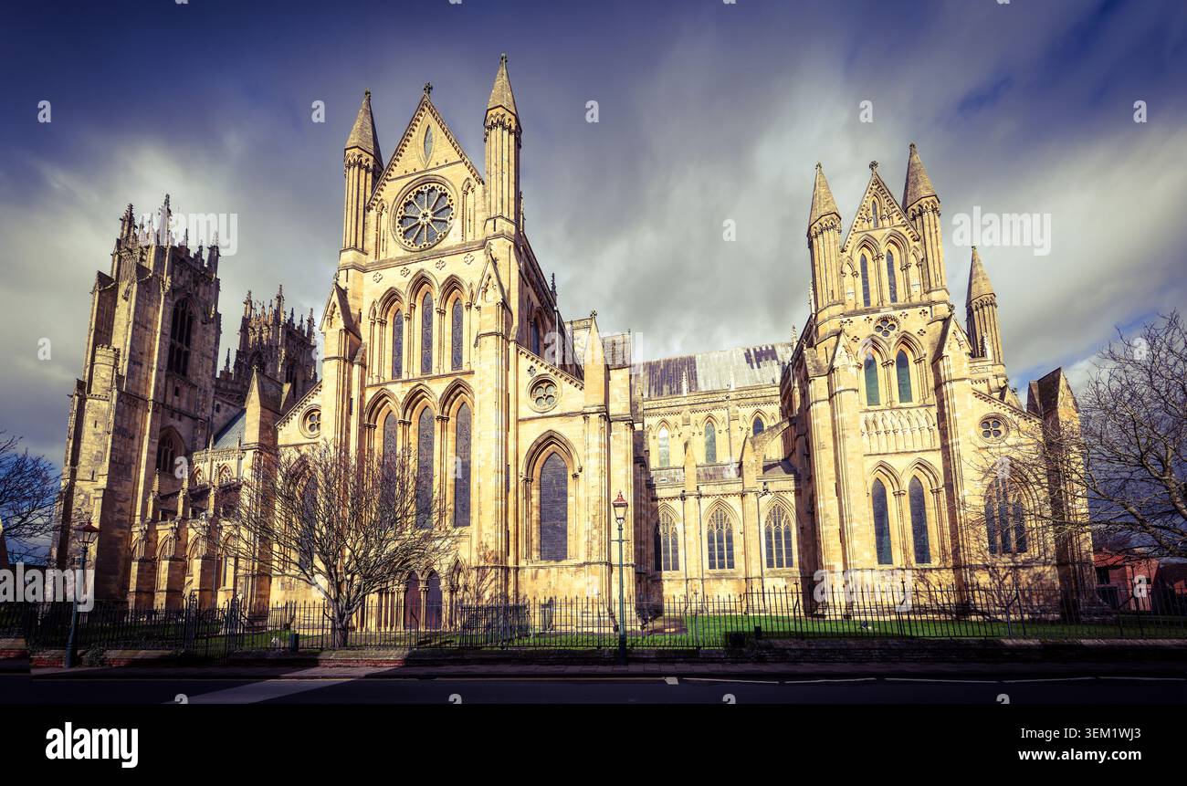Dramatic winter view of Beverley Minster, the great Gothic church in Beverley, East Yorkshire, under stormy winter sky Stock Photo