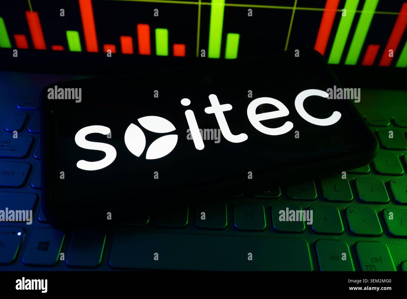 Soitec Semiconductor Engineered Substrate Materials Company Logo On A Screen With A Live Stock Chart In The Background Stock Photo