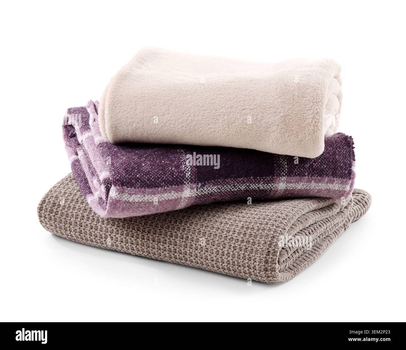 Stack of cozy blankets isolated on white background Stock Photo