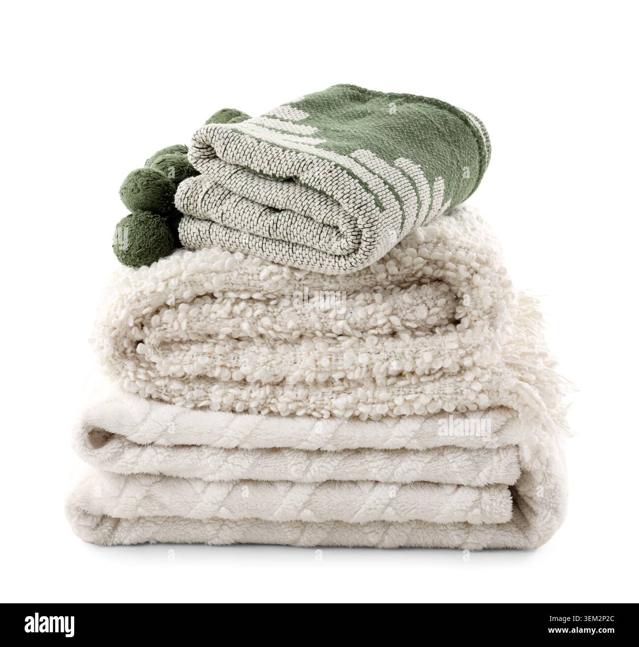Stack of different cozy blankets isolated on white background Stock Photo