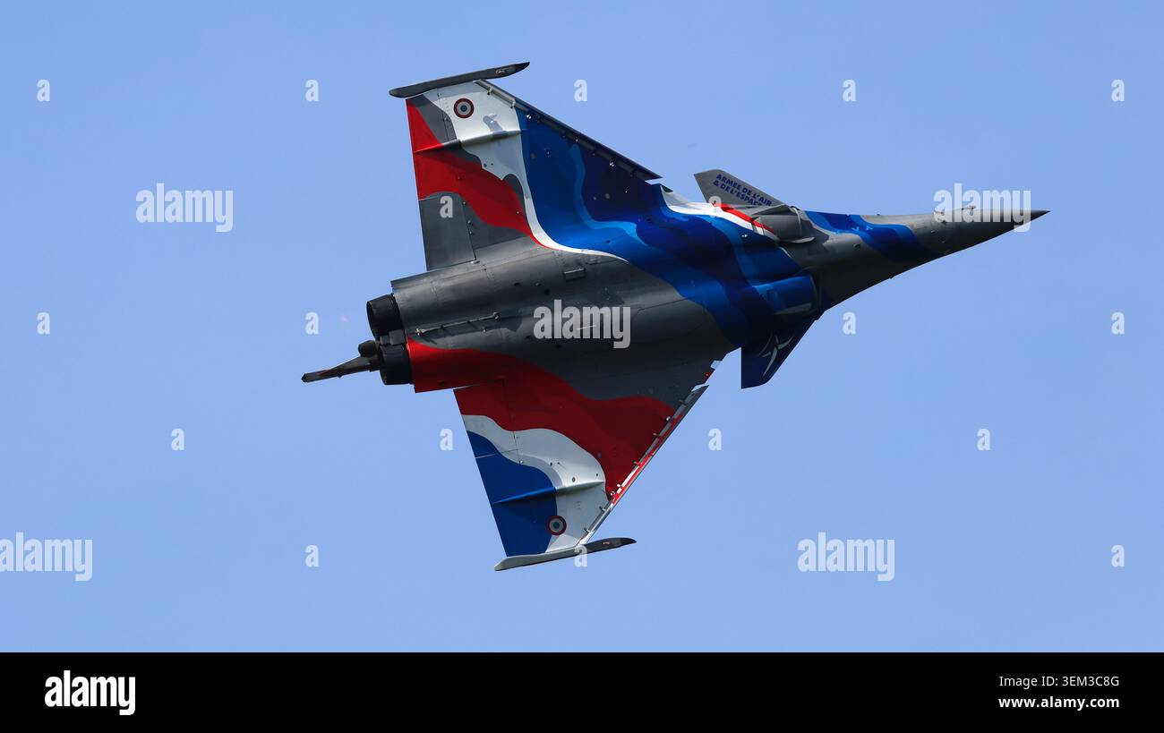 Tri Color Jet View of a Dassault Rafale fighter jet with a vibrant tricolor livery ...