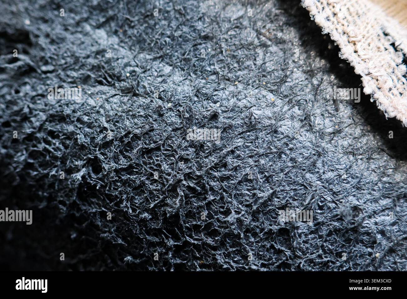 Texture background rough fiber dark grey fabric macro pattern raw surface creates calm mysterious feeling highlighting detailed interlaced materials f Stock Photo