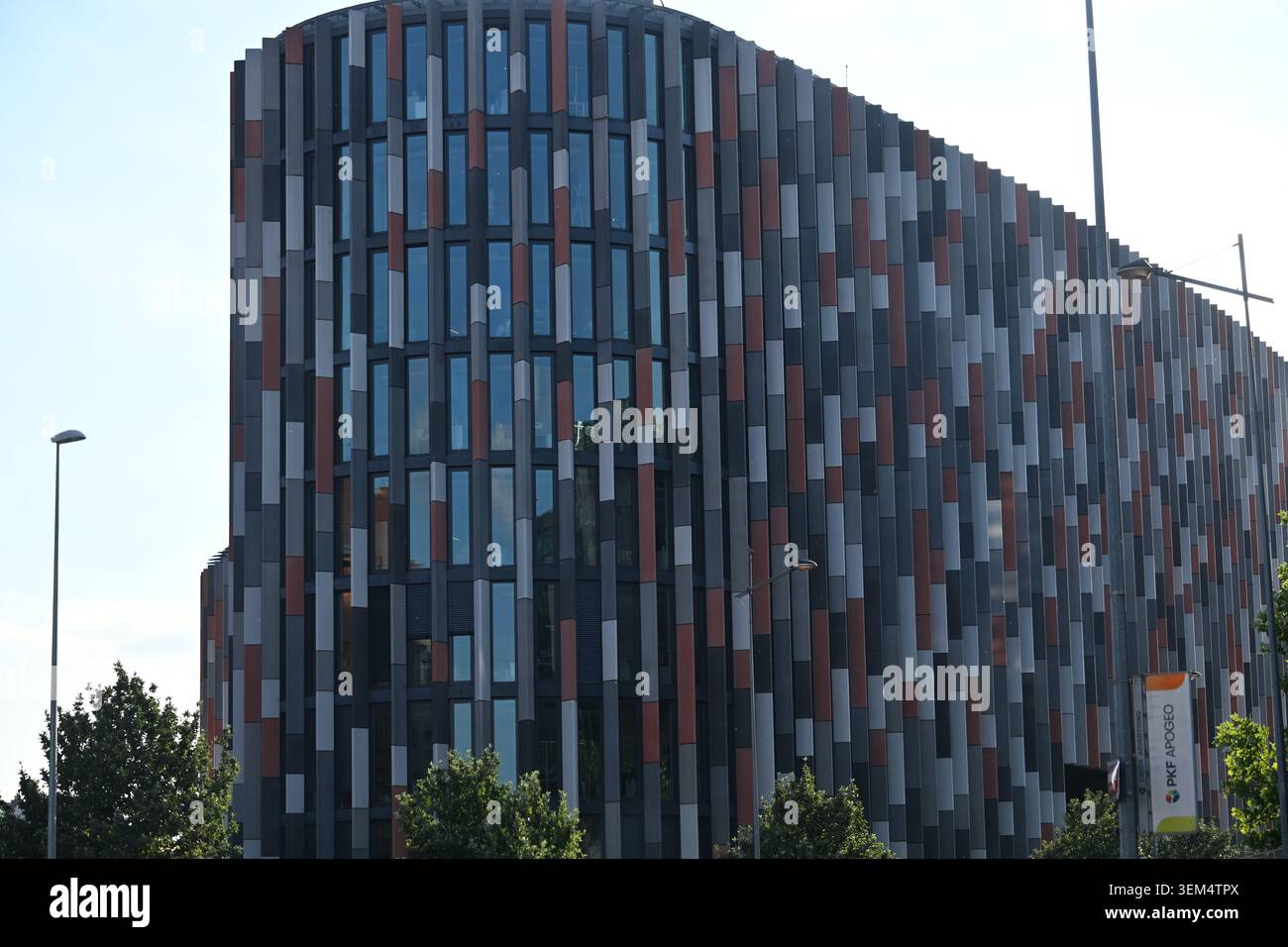 Modern Office Building Facade with Vertical Colorful Decorative Elements Stock Photo