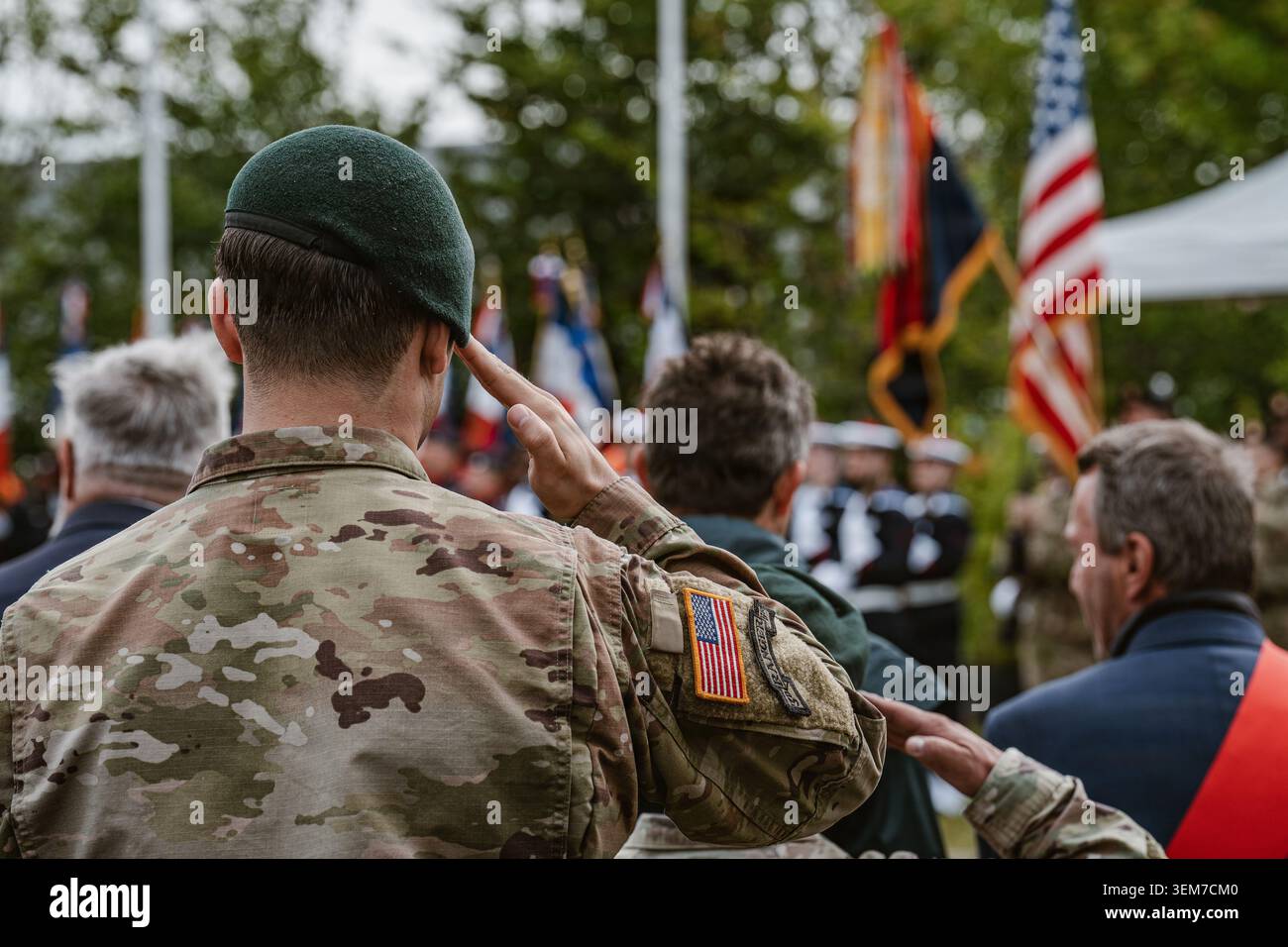 A U.S. Army Green Beret salutes during the playing of the national ...