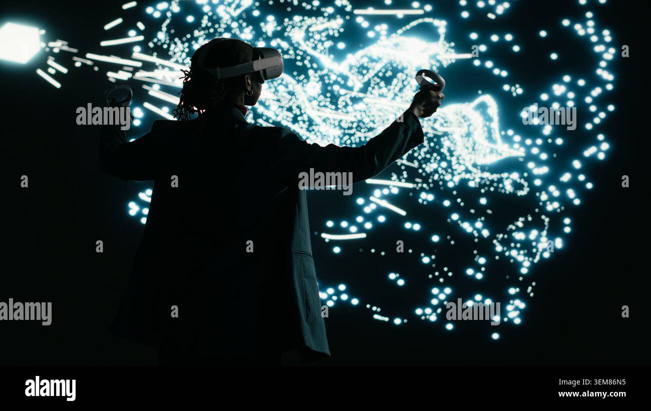Programmer optimizes AI neural network data flow using virtual reality simulation, adjusting nodes. Computer scientist uses VR headset gear to manipulate artificial intelligence architecture, camera B Stock Photo