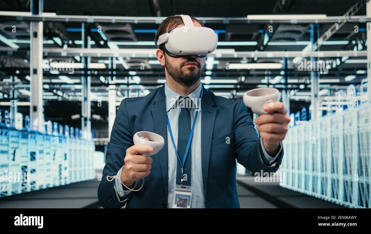 Data center programmer using VR headset tech to do equipment resource optimization. Server farm IT professional using virtual reality simulation to upgrade hardware supercomputers, camera A Stock Photo