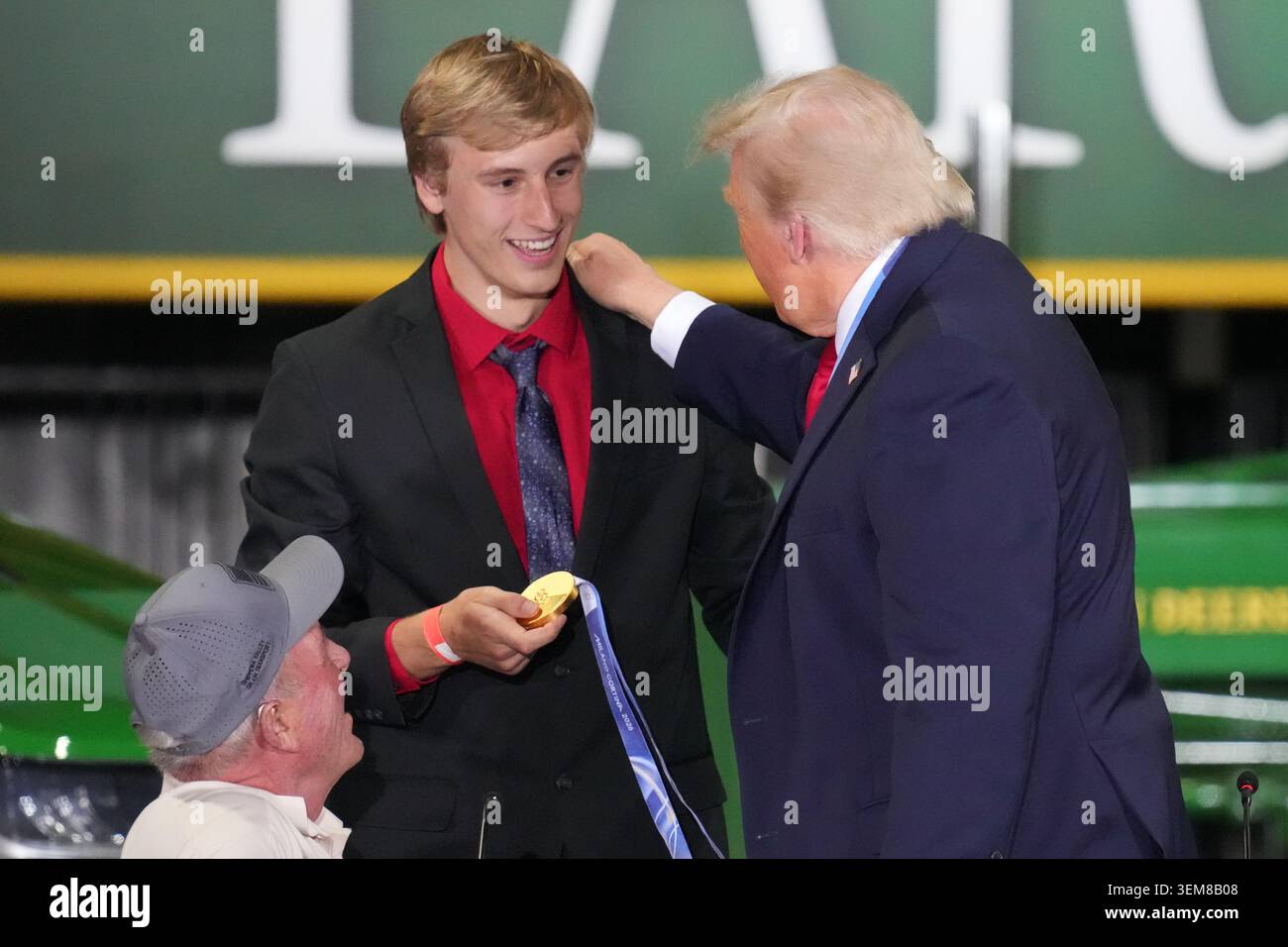 President Donald Trump talks with Olympic speedskater Jordan Stolz as ...