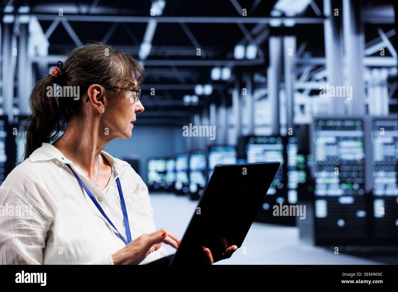 Supervisor overseeing high tech company providing computing resources needed for AI to process extensive datasets for training. Server devices storing datasets used for machine learning Stock Photo