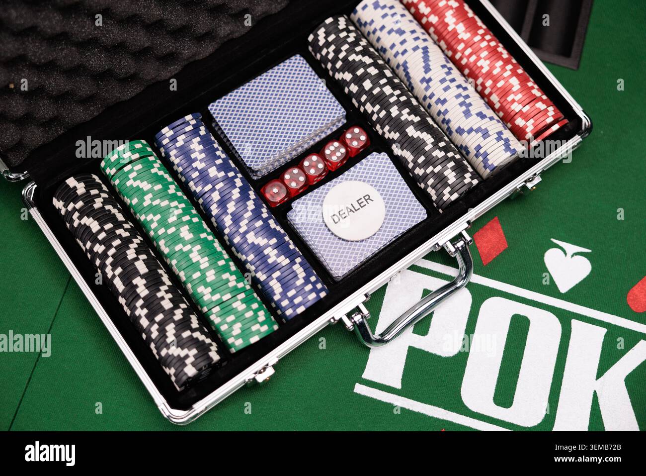 Playing cards and chips in a case on table Stock Photo