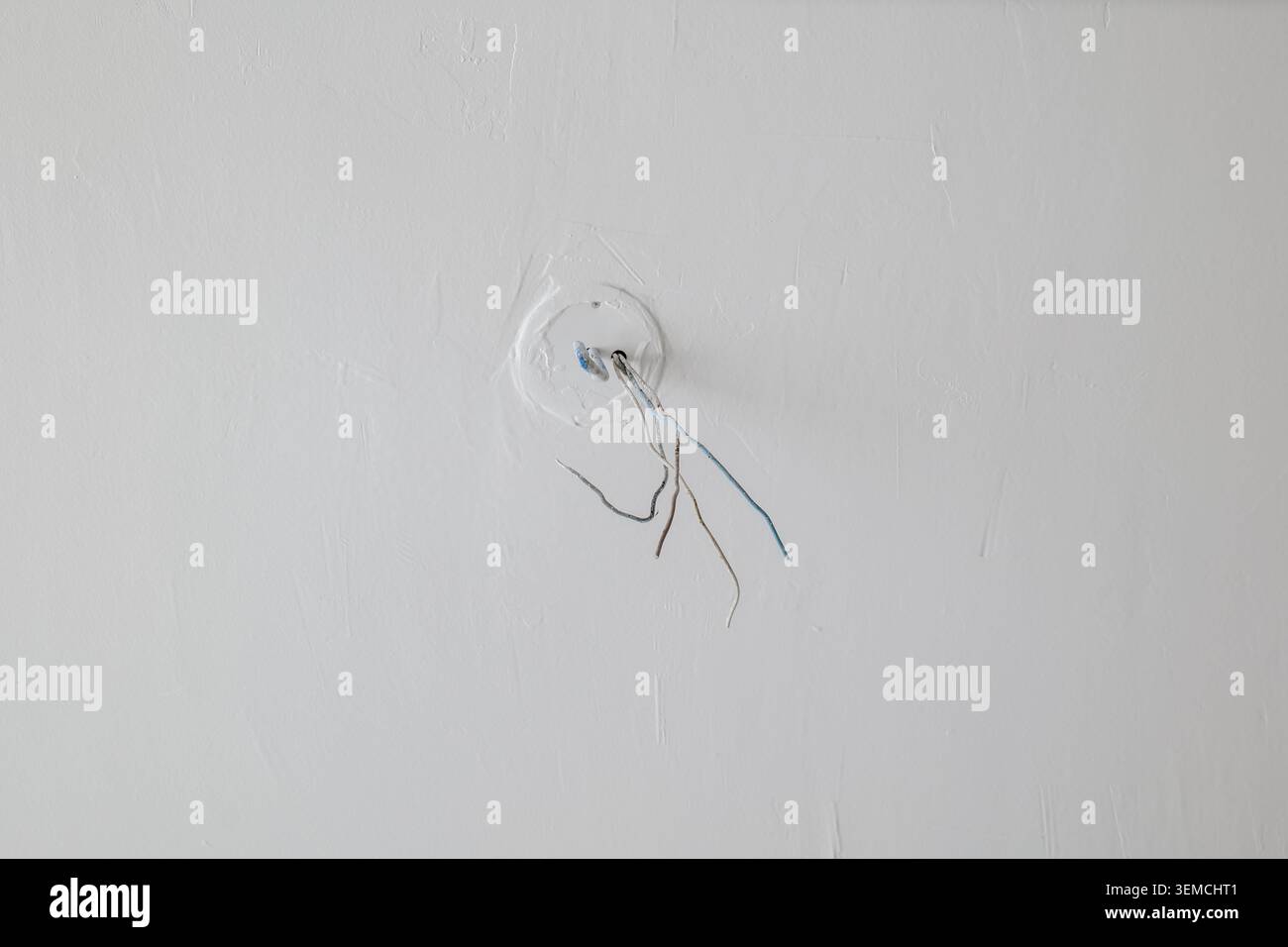 Exposed electrical wires in ceiling Stock Photo