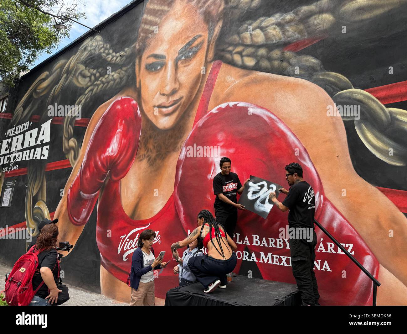 Unveiling of a large boxing-themed mural in Roma Norte, Mexico City, during promotional event Stock Photo